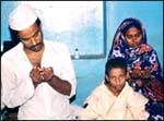 Abdul Manaf Jamadar and his family offer prayers